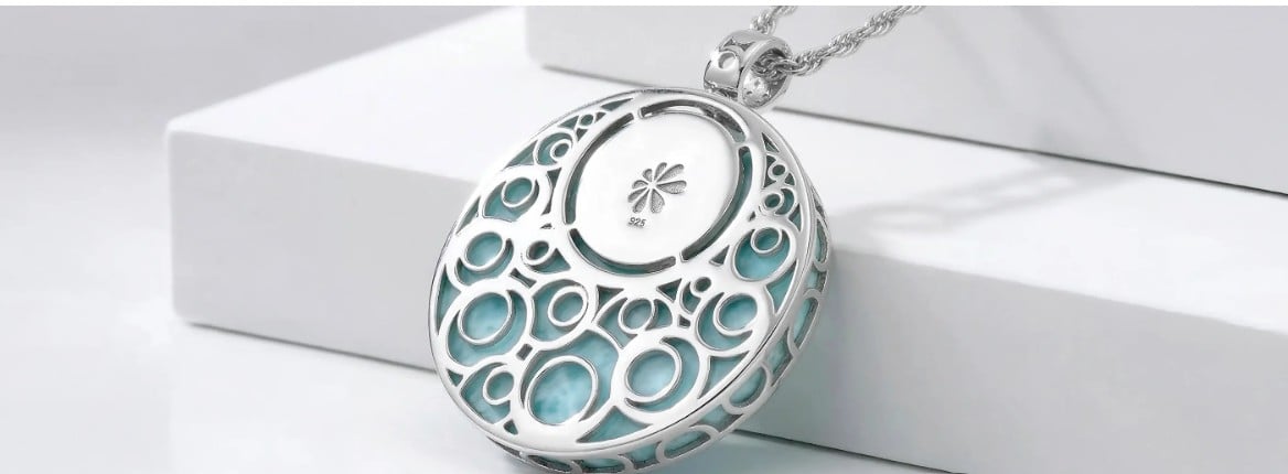 Back of a sterling silver Larimar pendant showing a solid, engineered gallery and 925 hallmark