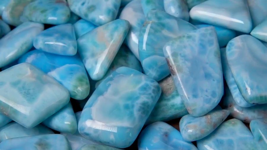 Deep blue and high quality Larimar gemstones that will be made into jewelry.