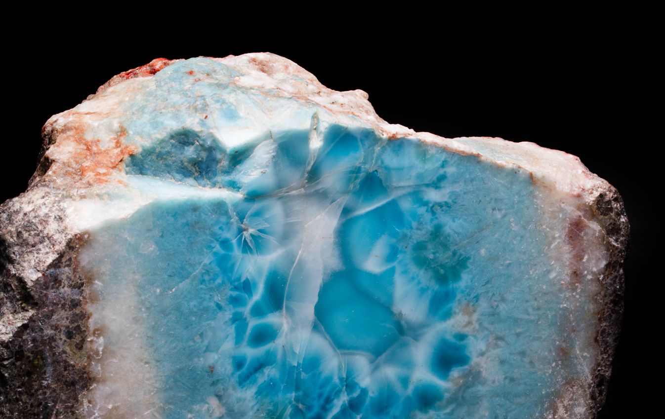 Cut Larimar stone. There is deep blue marbling, sign that it can be made into high quality jewelry.