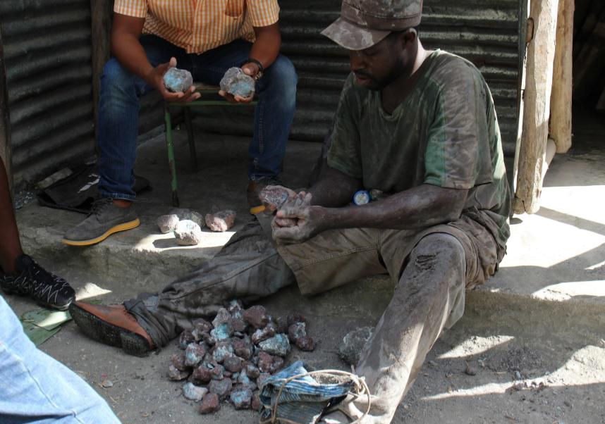 Larimar workers are selecting raw Larimar gemstones that will be used to make high quality jewelry.