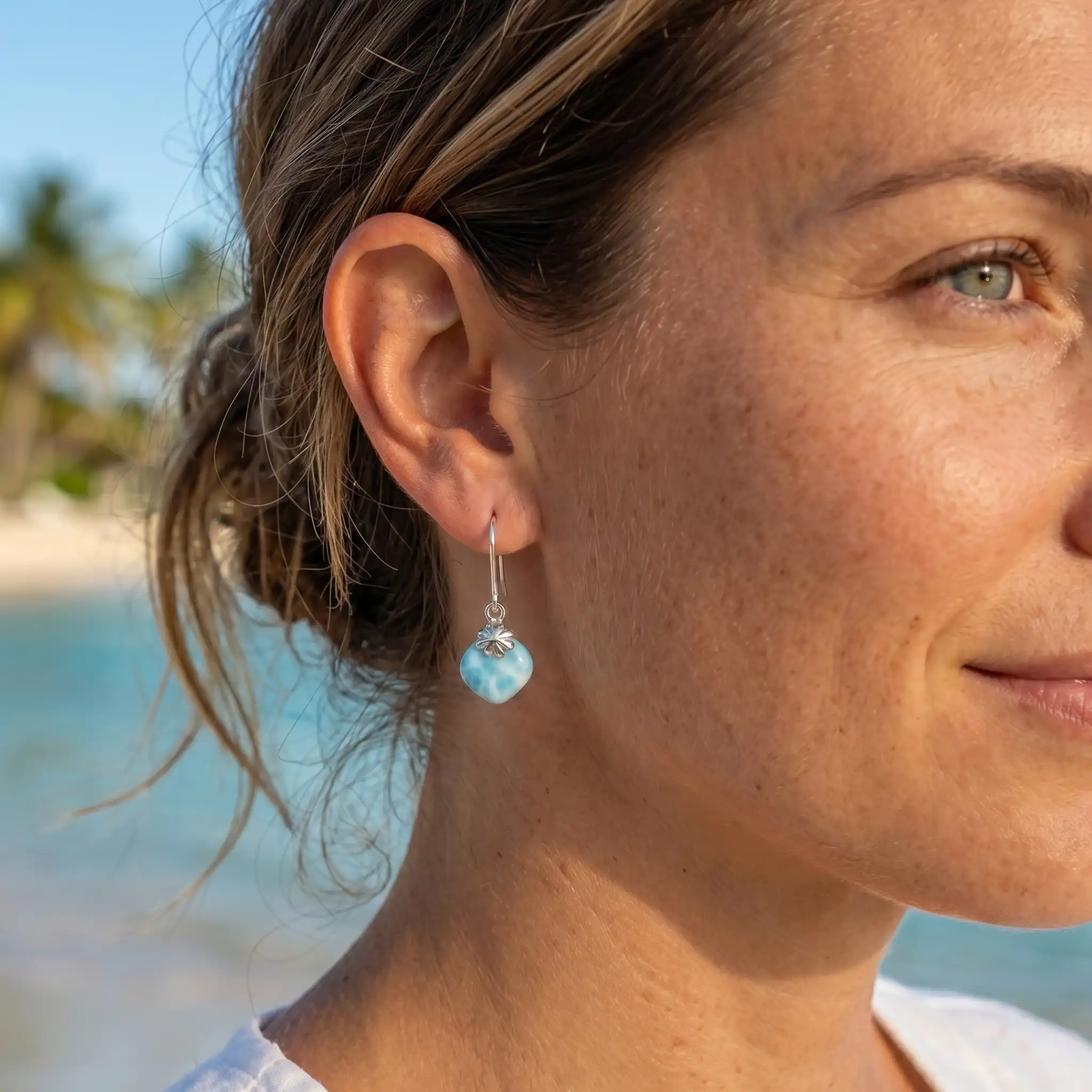 Cute Earrings with larimar white background