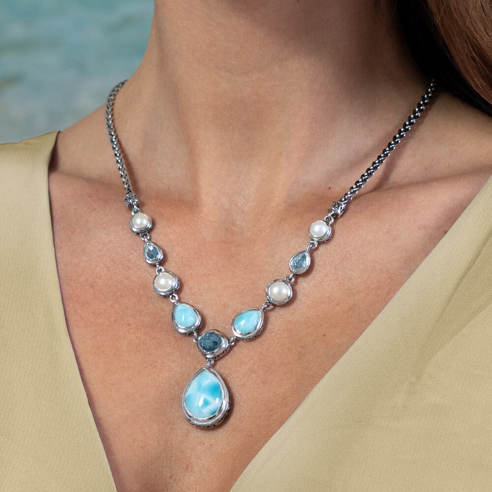 model with large Larimar necklace