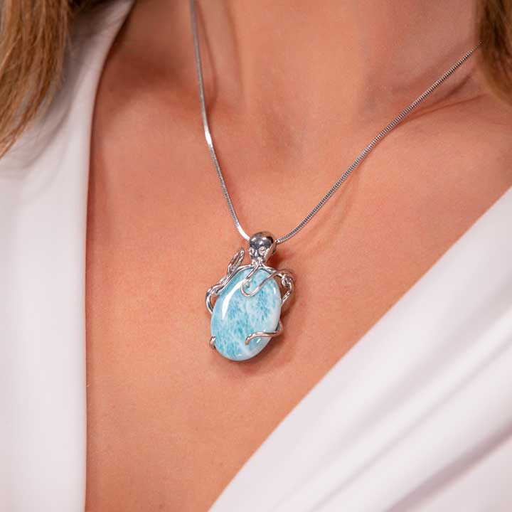Shop Marahlago's exquisite Larimar Sterling Silver Octopus Pendant Necklace. Featuring a stunning oval gemstone in silver blue, this elegant jewelry piece is perfect for women seeking timeless beauty.