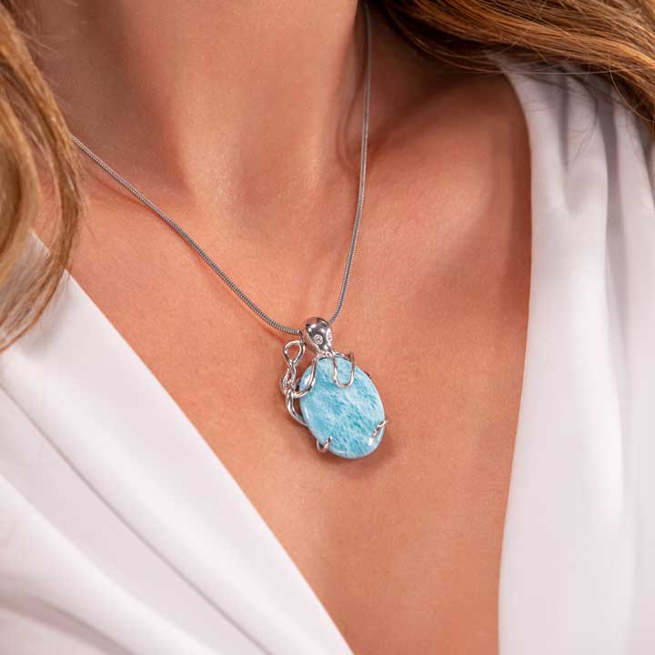 Shop Marahlago's exquisite Larimar Sterling Silver Octopus Pendant Necklace. Featuring a stunning oval gemstone in silver blue, this elegant jewelry piece is perfect for women seeking timeless beauty.