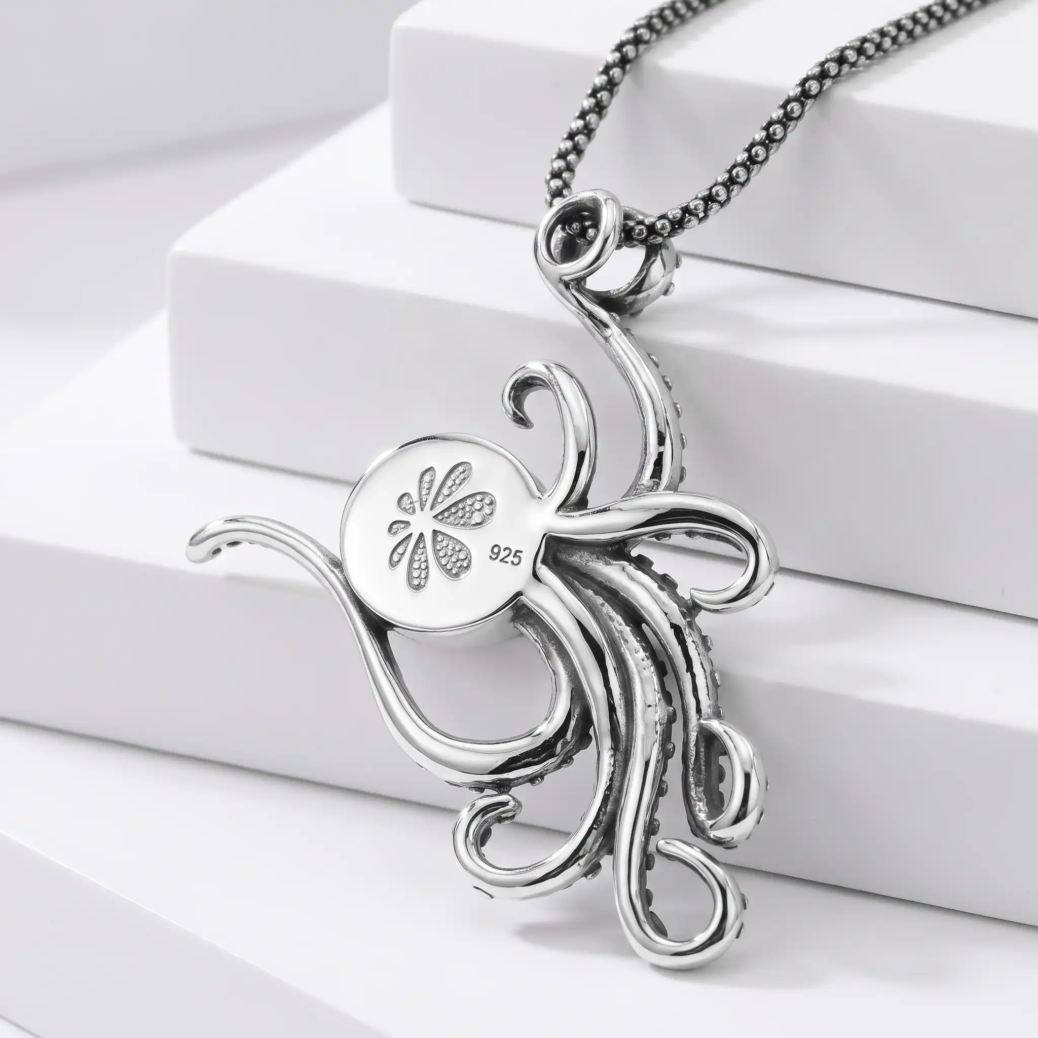 Octopus Pendant in Sterling silver on red coral