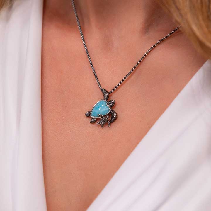 Embrace the charm of Marahlago's Larimar Sterling Silver Turtle and Baby Pendant Necklace. This exquisite jewelry piece in silver blue is perfect for women seeking elegance and style.
