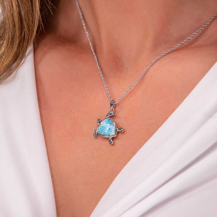 Fall in love with Marahlago's Larimar Sterling Silver Turtle Heart Pendant Necklace. Adorned with a heart-shaped silver blue gemstone, this captivating jewelry piece is a symbol of love and elegance for women.