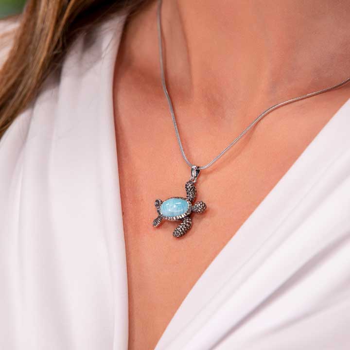 Discover the exquisite Larimar Sterling Silver Turtle Pendant Necklace by Marahlago Jewelry. Adorned with an oval silver blue gemstone, this jewelry piece is perfect for women seeking elegance and sophistication.